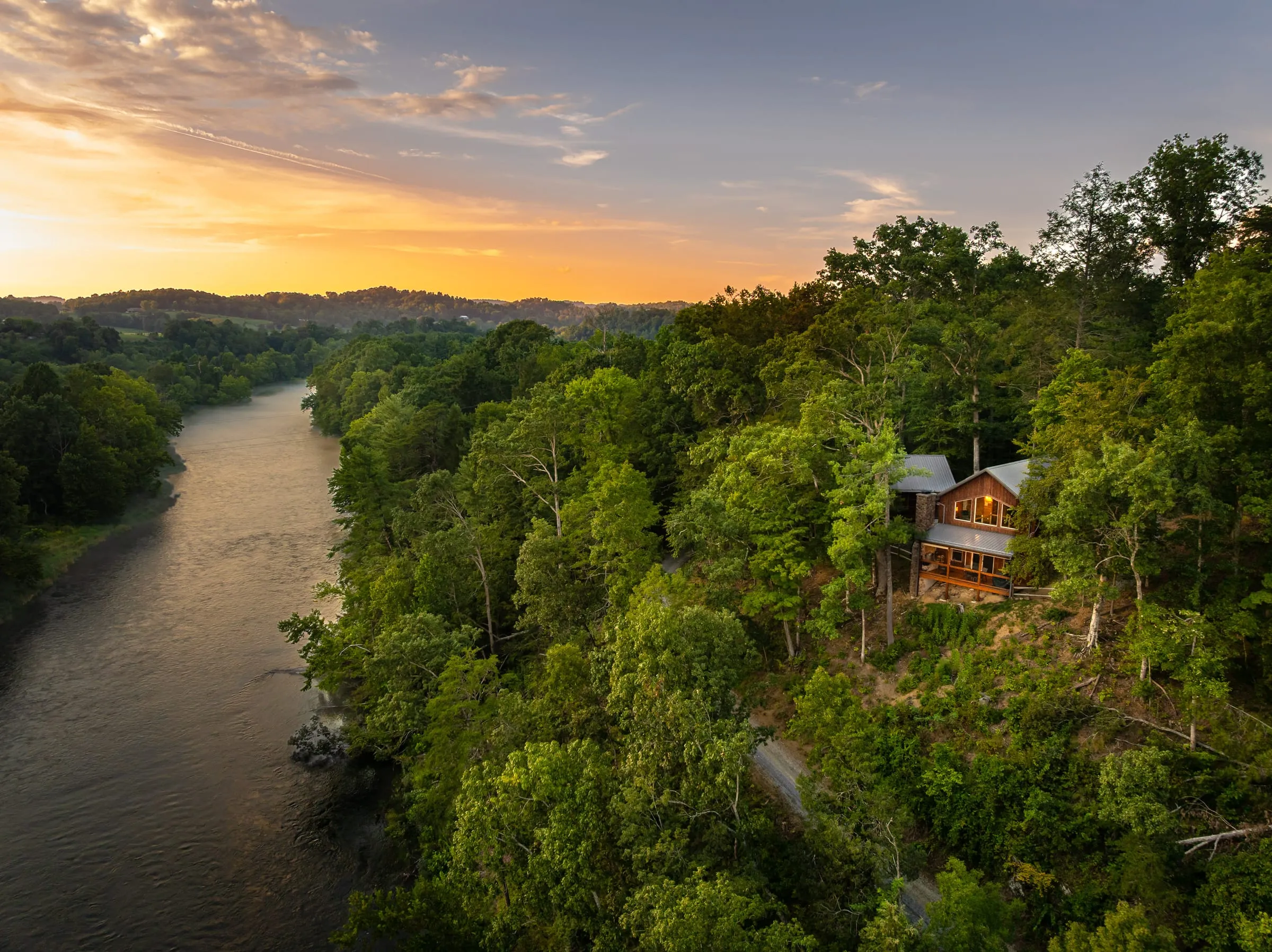 Aerial view of the South Holston River winding through the hills at sunset